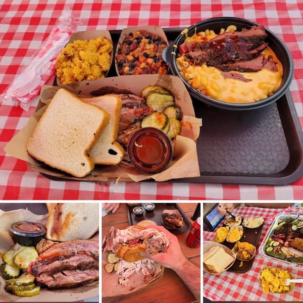 Brisket BBQ platter with mac and cheese, cornbread, baked beans, and pickles on a red checkered tablecloth.